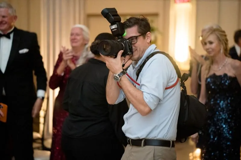 Rob photographing a wedding reception